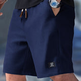 Pantaloncini slim fit con coulisse regolabile da uomo