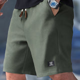 Pantaloncini slim fit con coulisse regolabile da uomo