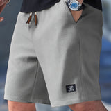 Pantaloncini slim fit con coulisse regolabile da uomo