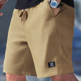 Pantaloncini slim fit con coulisse regolabile da uomo