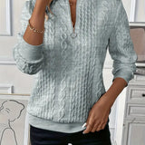 Maglione a treccia con zip al collo